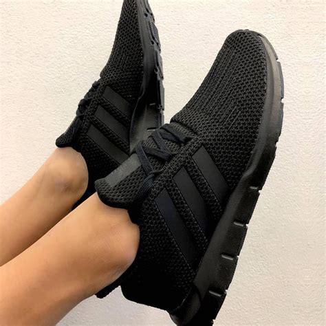 adidas all black sneakers.